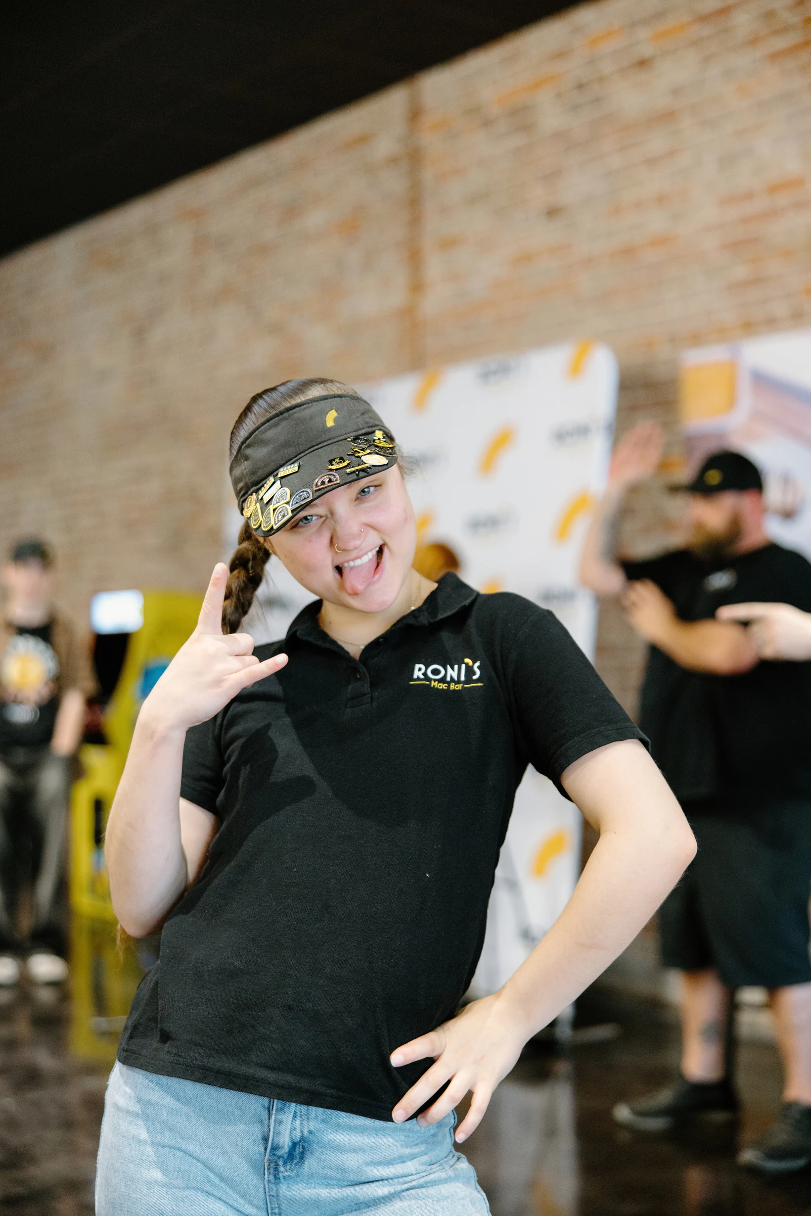 A smiling Roni’s team member in uniform